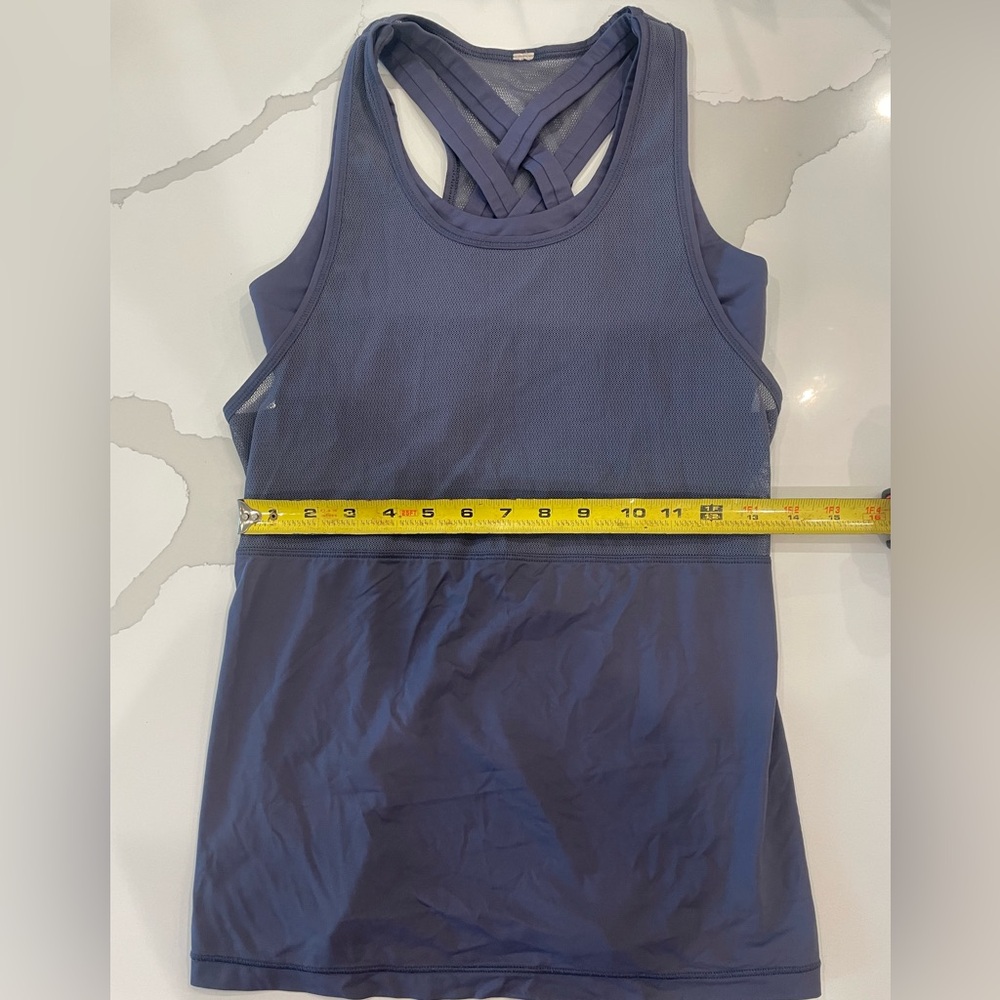 Lululemon women’s tank top with built in sports bra. Estimated size medium.